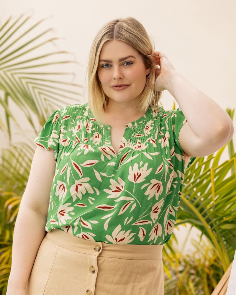 Side of a model wearing a size 2X Novah Floral Top with Split Neck in O046 LIME by Daniel Rainn. | dia_product_style_image_id:299248